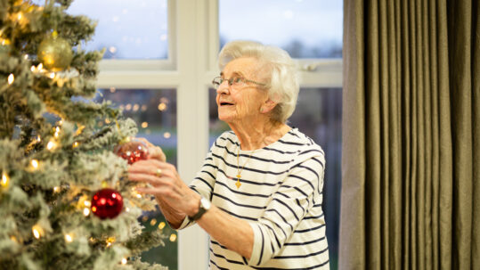 Jean decorating the Christmas tree